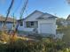 Newly constructed home with white exterior and a spacious backyard at 3307 W Oak Ave, Plant City, FL 33563