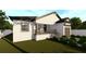 Contemporary house with white exterior, dark brown trim, and landscaped yard at 3307 W Oak Ave, Plant City, FL 33563