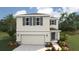 Two-story house with gray siding, gray shutters, and a two-car garage at 3479 Hilltop Cir, Lakewood Ranch, FL 34211