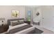Cozy bedroom with a queen-size bed and sitting chair at 3483 Hilltop Cir, Lakewood Ranch, FL 34211