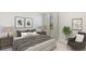 Spacious bedroom with a king-size bed, nightstands and a relaxing armchair at 3483 Hilltop Cir, Lakewood Ranch, FL 34211