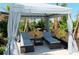 Private cabana with comfortable seating and a small table at 3483 Hilltop Cir, Lakewood Ranch, FL 34211
