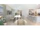 Open dining area with view of kitchen and living room at 3483 Hilltop Cir, Lakewood Ranch, FL 34211