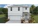 Two-story house with gray siding, stone accents, and a two-car garage at 3483 Hilltop Cir, Lakewood Ranch, FL 34211