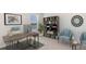 Modern home office features a large desk, built-in shelving, and comfortable seating at 3483 Hilltop Cir, Lakewood Ranch, FL 34211