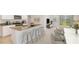 Modern kitchen with granite countertops, island, and stainless steel appliances at 3483 Hilltop Cir, Lakewood Ranch, FL 34211