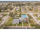 Aerial view of community pool, clubhouse, and neighborhood at 4084 Lake Blvd, Clearwater, FL 33762