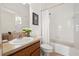 Clean bathroom with a shower/tub combo and a wood vanity at 4112 Walden View Dr, Brandon, FL 33511