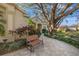 House entrance with bench and mature trees in the front yard at 4112 Walden View Dr, Brandon, FL 33511