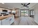 Modern kitchen with white cabinets, stainless steel appliances, and a butcher block island at 4411 Mongite Rd, North Port, FL 34287