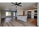 Open concept kitchen with white cabinets and stainless steel appliances at 4411 Mongite Rd, North Port, FL 34287