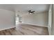 Spacious living area with wood-look floors and multiple ceiling fans at 4411 Mongite Rd, North Port, FL 34287