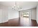 Living room with tile floors and sliding glass doors leading to a patio at 4842 Pond Ridge Dr, Riverview, FL 33578