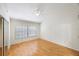 Bedroom with wood-look floors and a large window at 5100 Burchette Rd # 3204, Tampa, FL 33647