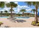 Relaxing pool area with palm trees and shaded seating at 5283 Everlong Dr, Apollo Beach, FL 33572