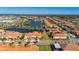 House location shown from above with pond nearby at 5328 Stoic Vale Dr, Wimauma, FL 33598