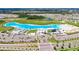 Aerial view of Crystal Lagoon amenity, including beach and parking at 5328 Stoic Vale Dr, Wimauma, FL 33598