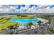 Resort-style pool with expansive sandy beach and surrounding landscape at 5328 Stoic Vale Dr, Wimauma, FL 33598