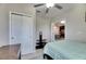 Light and airy bedroom with a view of the kitchen and a double bed at 5328 Stoic Vale Dr, Wimauma, FL 33598