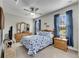 Bedroom with a full-size bed and wood furniture at 5328 Stoic Vale Dr, Wimauma, FL 33598