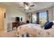 Spacious bedroom with a queen bed and ensuite bathroom access at 5328 Stoic Vale Dr, Wimauma, FL 33598