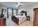 Bright bedroom with a double bed and large window at 5328 Stoic Vale Dr, Wimauma, FL 33598