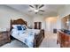 Bedroom with a double bed, dresser, and ceiling fan at 5328 Stoic Vale Dr, Wimauma, FL 33598