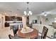 Kitchen and dining room with round table and chandelier at 5328 Stoic Vale Dr, Wimauma, FL 33598