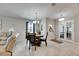 Elegant dining room with chandelier and French doors at 5328 Stoic Vale Dr, Wimauma, FL 33598
