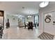 Open concept dining area with a view into the living room and kitchen at 5328 Stoic Vale Dr, Wimauma, FL 33598