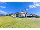 Two-story house with tile roof, garage, and spacious lawn at 5328 Stoic Vale Dr, Wimauma, FL 33598