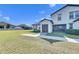 View of house's garage and backyard at 5328 Stoic Vale Dr, Wimauma, FL 33598