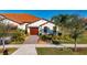 House with tile roof, landscaping, and driveway at 5328 Stoic Vale Dr, Wimauma, FL 33598