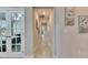 Bright hallway with tile flooring and french doors at 5328 Stoic Vale Dr, Wimauma, FL 33598