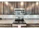 Stainless steel appliances and granite countertops at 5328 Stoic Vale Dr, Wimauma, FL 33598