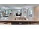 Kitchen island with double sink overlooking living room at 5328 Stoic Vale Dr, Wimauma, FL 33598