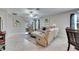 Bright living room features sliding glass doors to lanai at 5328 Stoic Vale Dr, Wimauma, FL 33598