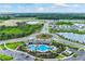 Wide shot of community, pool, and landscape at 5640 Silver Moonlight Dr, Palmetto, FL 34221