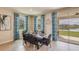 Bright dining area with a wooden table and lake view at 5640 Silver Moonlight Dr, Palmetto, FL 34221