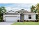 One-story home with a two-car garage and stone accents at 5640 Silver Moonlight Dr, Palmetto, FL 34221