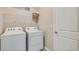 Convenient laundry room with side-by-side washer and dryer at 5640 Silver Moonlight Dr, Palmetto, FL 34221