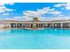 Relaxing community pool area with shaded seating at 5640 Silver Moonlight Dr, Palmetto, FL 34221