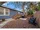 Fenced backyard with patio, grill, and large tree at 6297 29Th N St, St Petersburg, FL 33702