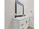 Modern bathroom with a white vanity and large mirror at 6297 29Th N St, St Petersburg, FL 33702