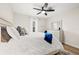 Bright bedroom with a queen-size bed, dresser, and ceiling fan at 6297 29Th N St, St Petersburg, FL 33702