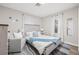 Guest bedroom with a queen bed and comfy seating area at 6297 29Th N St, St Petersburg, FL 33702