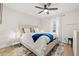 Bright bedroom with a wooden bed frame and ceiling fan at 6297 29Th N St, St Petersburg, FL 33702