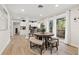 Open concept dining area with round table and bench seating at 6297 29Th N St, St Petersburg, FL 33702