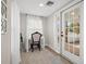 Bright and airy entryway with built-in desk and French doors at 6297 29Th N St, St Petersburg, FL 33702
