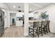 Modern kitchen with white cabinets and breakfast bar at 6297 29Th N St, St Petersburg, FL 33702